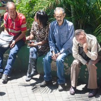 Venezuelans waiting to enter a bank