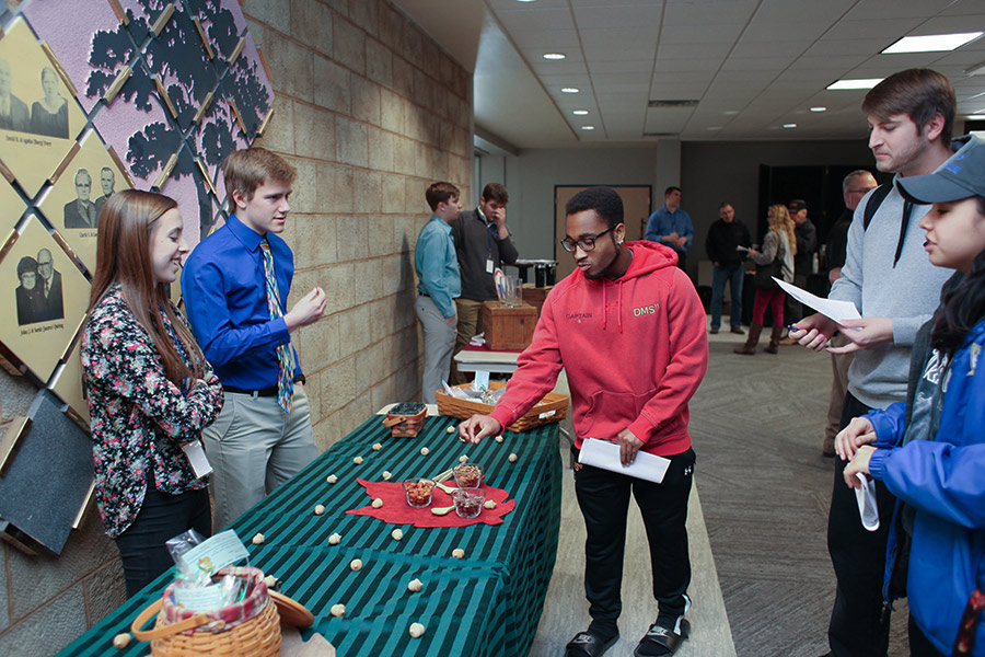 Students learn more about NetWork Kansas E-Community Youth Entrepreneurship Challenge, 2019-2020, while enjoying free snack samples.