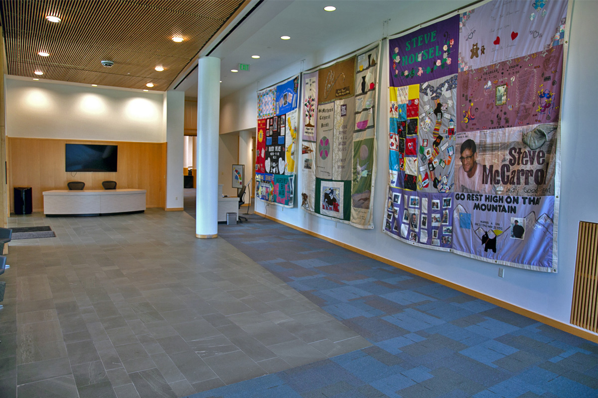 The lobby of the Kauffman Foundation Conference Center, featuring three AIDS Memorial Quilts from the NAMES Project.