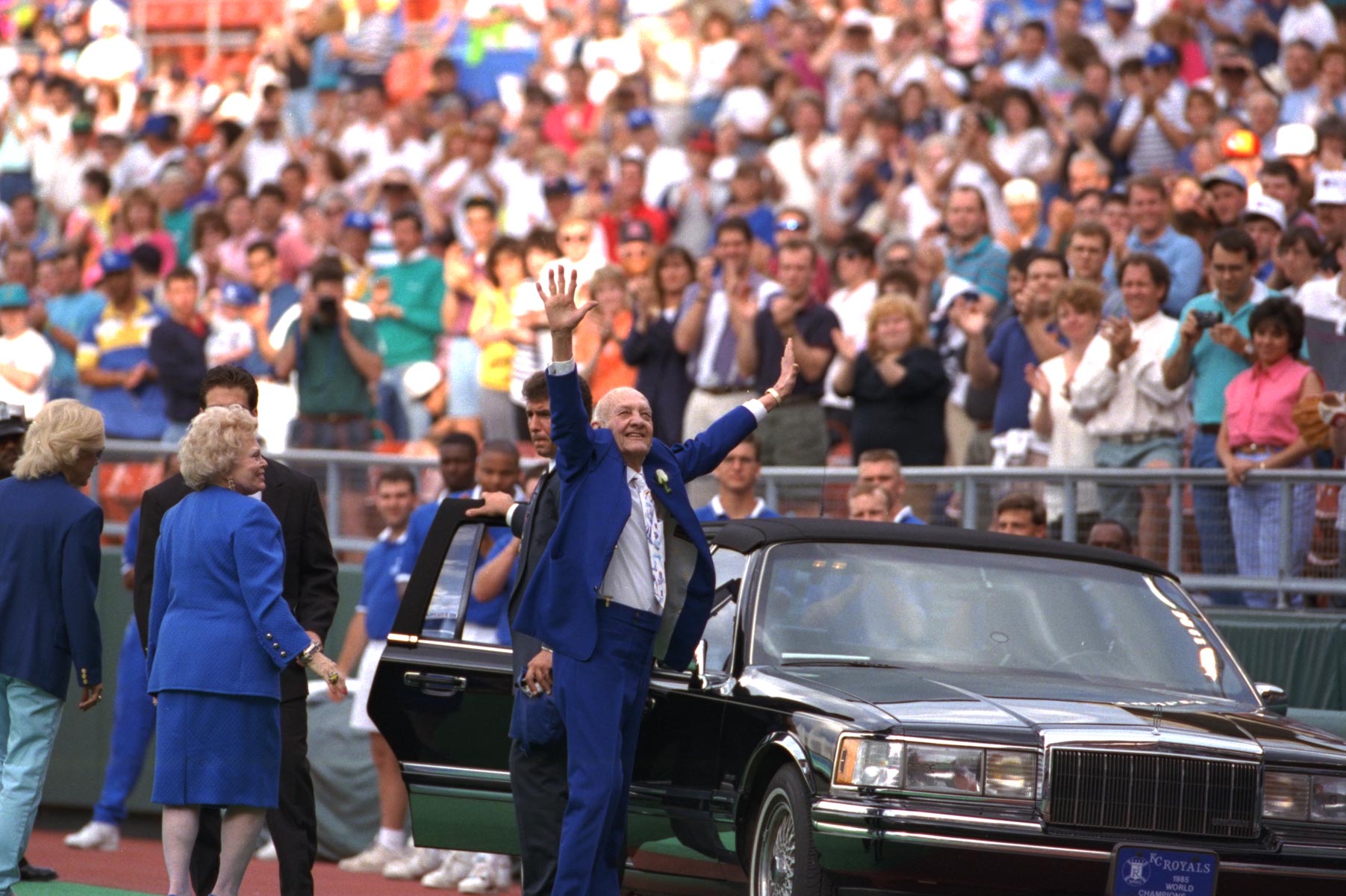 At Mr. Kauffman's last public appearance, he greets a crowd wearing a Royal blue suit.