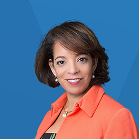 A photo of Alejandra Y. Castillo on top of a blue background.