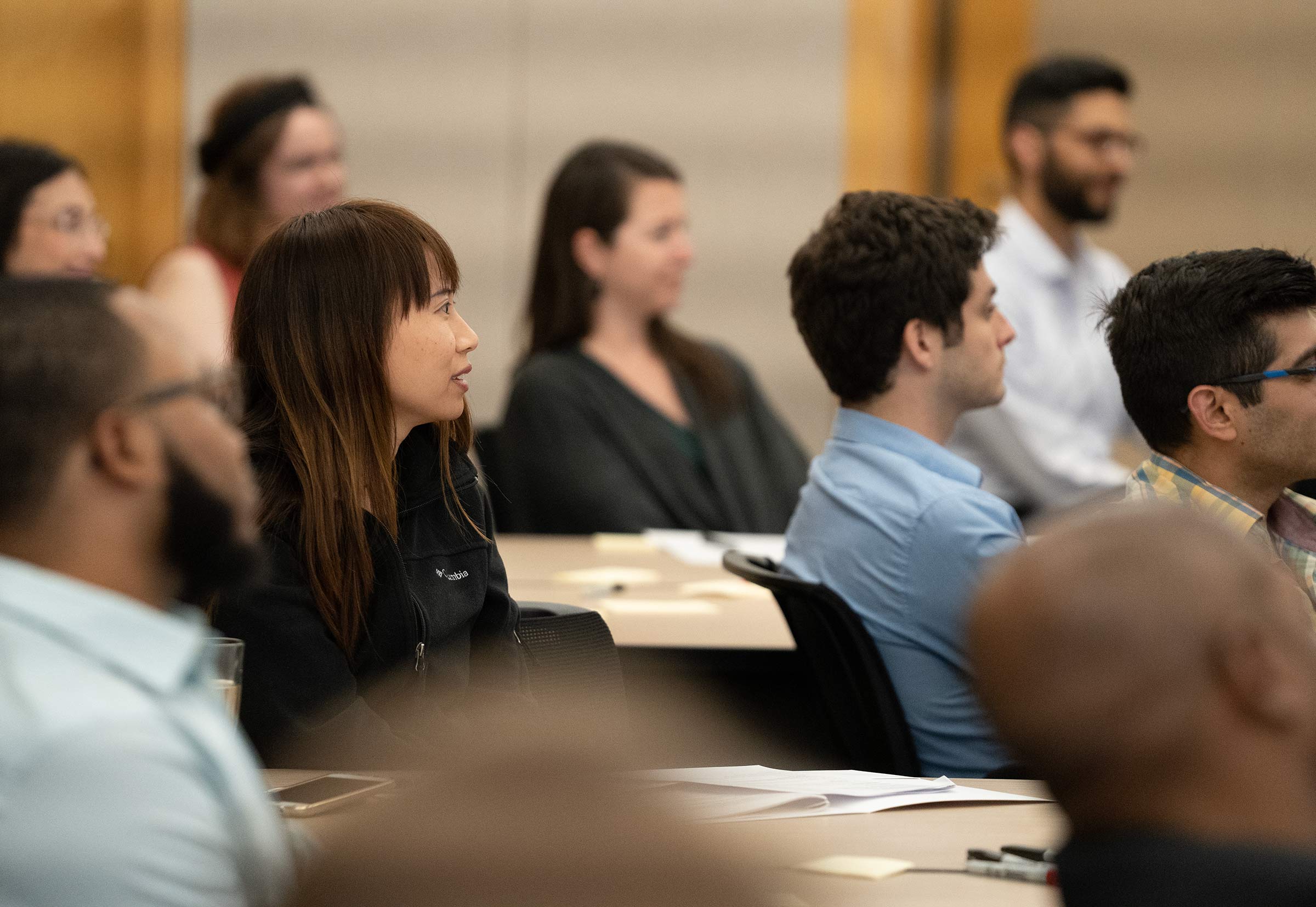 A group of researchers listen to a facilitator inside a Kauffman Foundation Conference Center room.