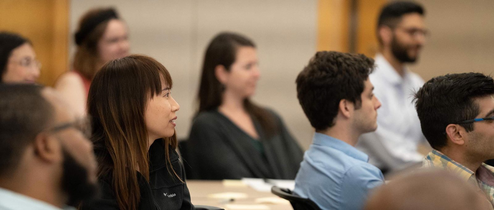 A group of researchers listen to a facilitator inside a Kauffman Foundation Conference Center room.