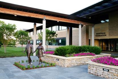 The front entrance of the Ewing Marion Kauffman Foundation features two bronze statues of Mr. and Mrs. Kauffman.