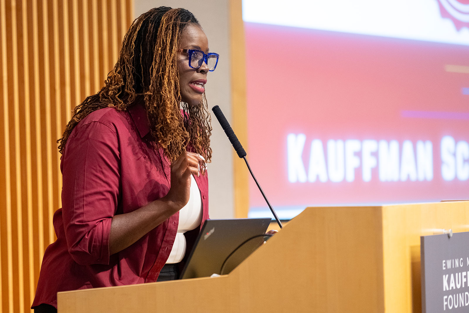 Tanesha Ford, executive director of Kauffman Scholars, speaks at the ribbon-cutting ceremony.