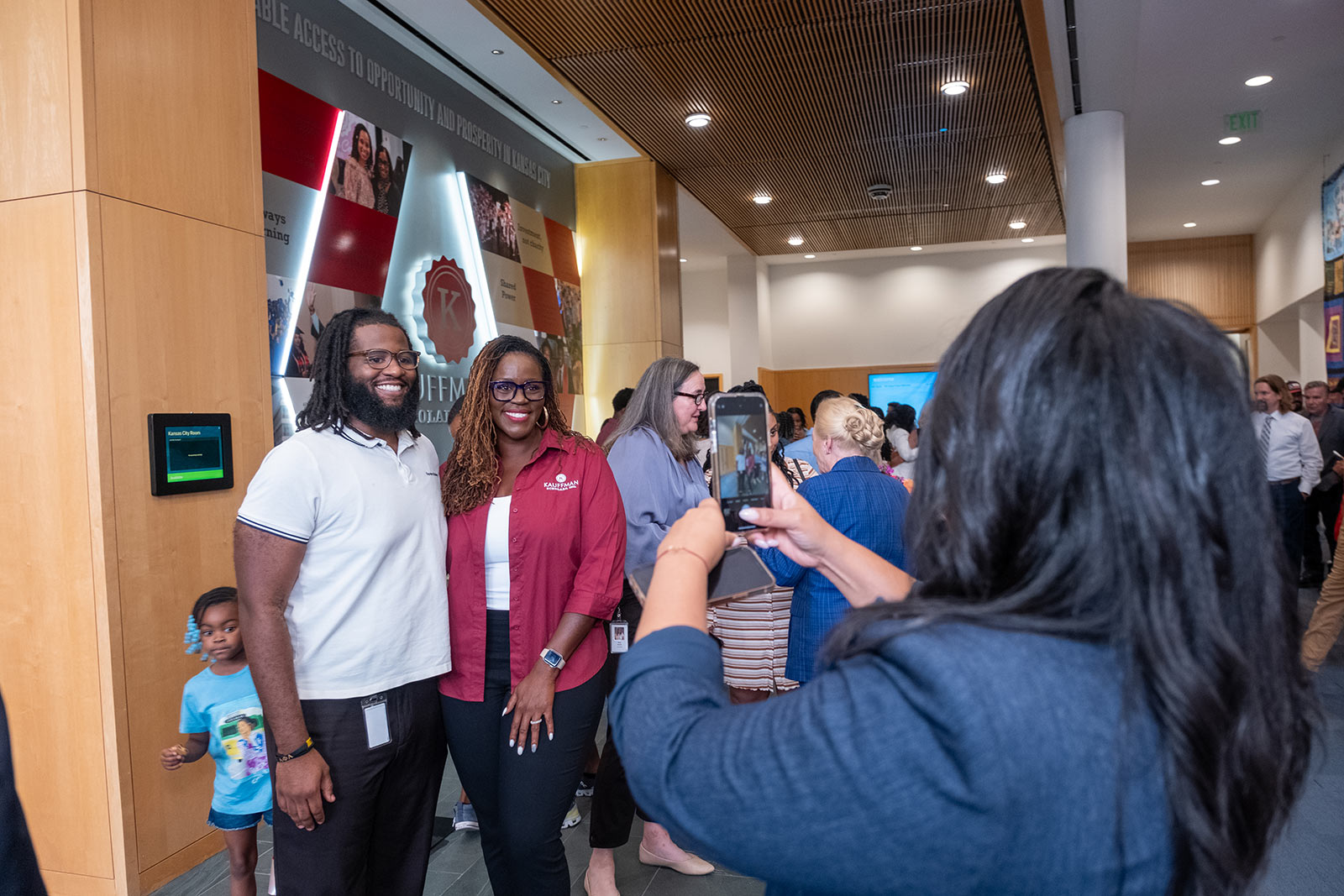 Photos in front of the KSI Legacy Wall.