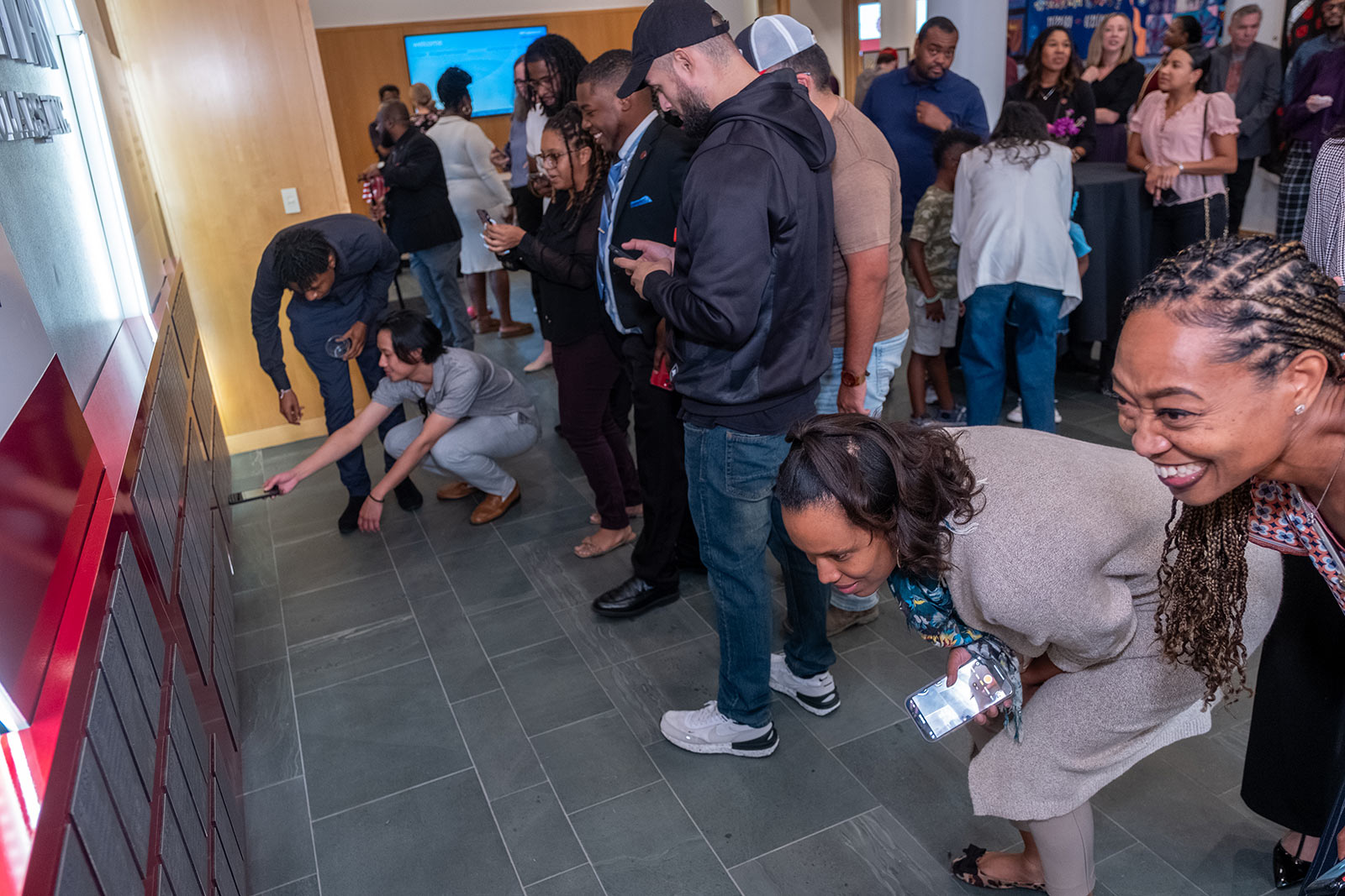 Event attendees admire the KSI Legacy Wall.