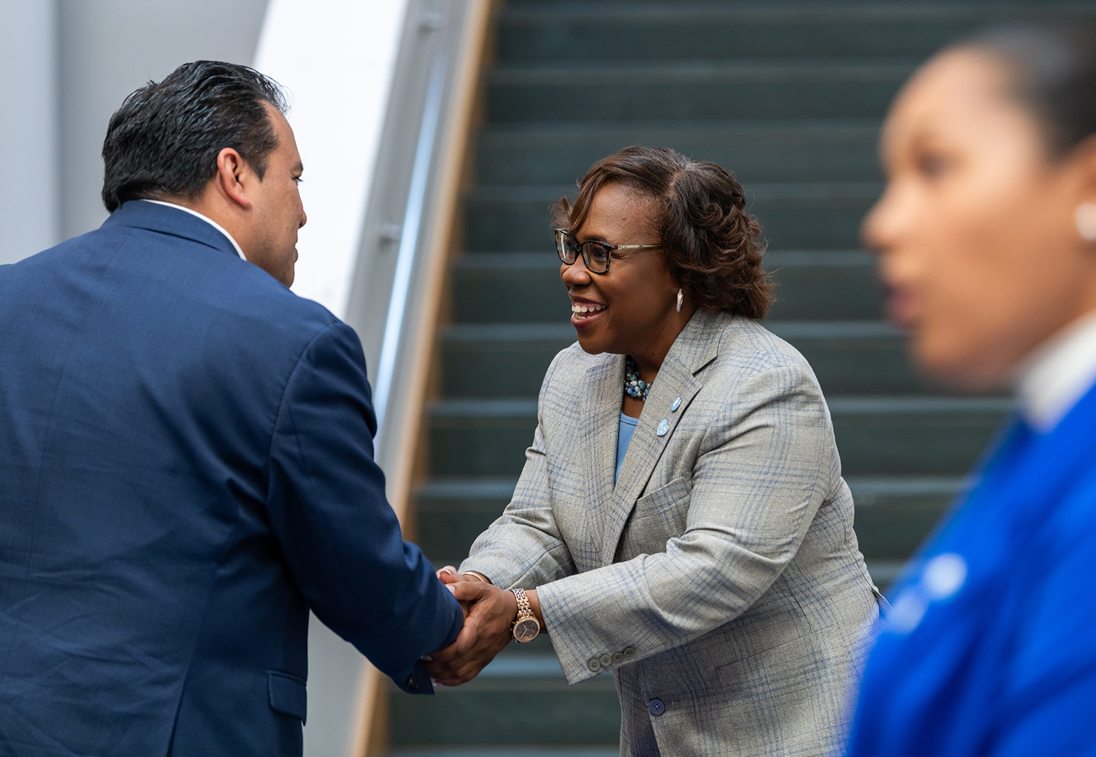 Dr. DeAngela Burns-Wallace greets community members at the end of the blue carpet at the Kauffman Foundation's Open House event Sept. 28, 2023.