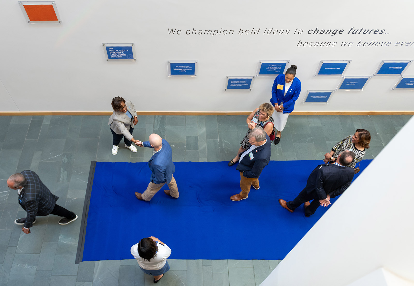 Dr. DeAngela Burns-Wallace greets community members at the end of the blue carpet at the Kauffman Foundation's Open House event Sept. 28, 2023.