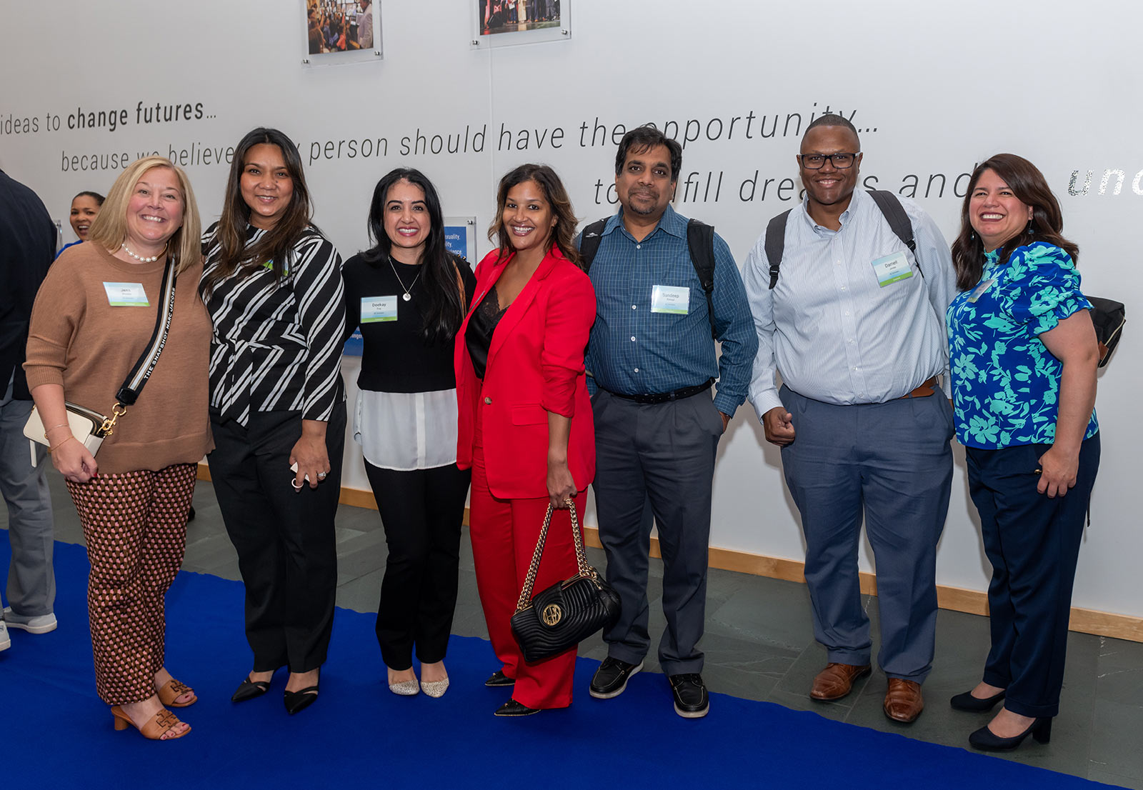 Community members pose on the Blue Carpet at the Open House event at Kauffman Foundation Sept. 28, 2023.