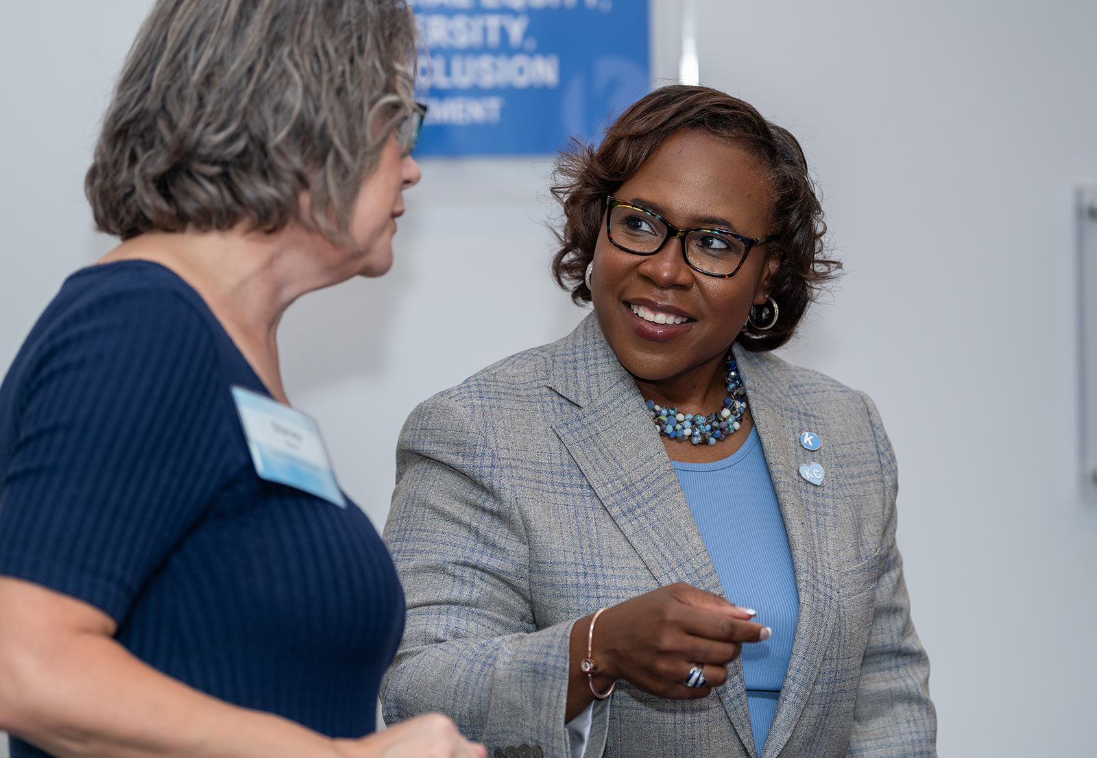 Dr. DeAngela Burns-Wallace greets community members at the end of the blue carpet at the Kauffman Foundation's Open House event Sept. 28, 2023.