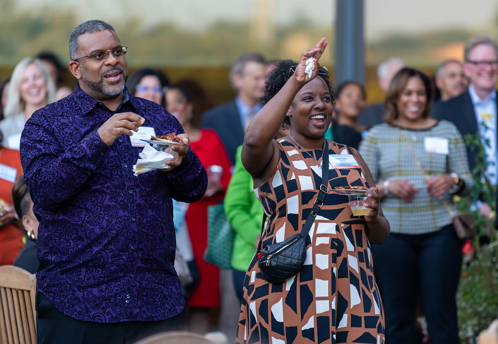 Community members gather in the Kauffman Foundation courtyard during Dr. DeAngela Burns-Wallace's remarks at the Open House event Sept. 28, 2023.