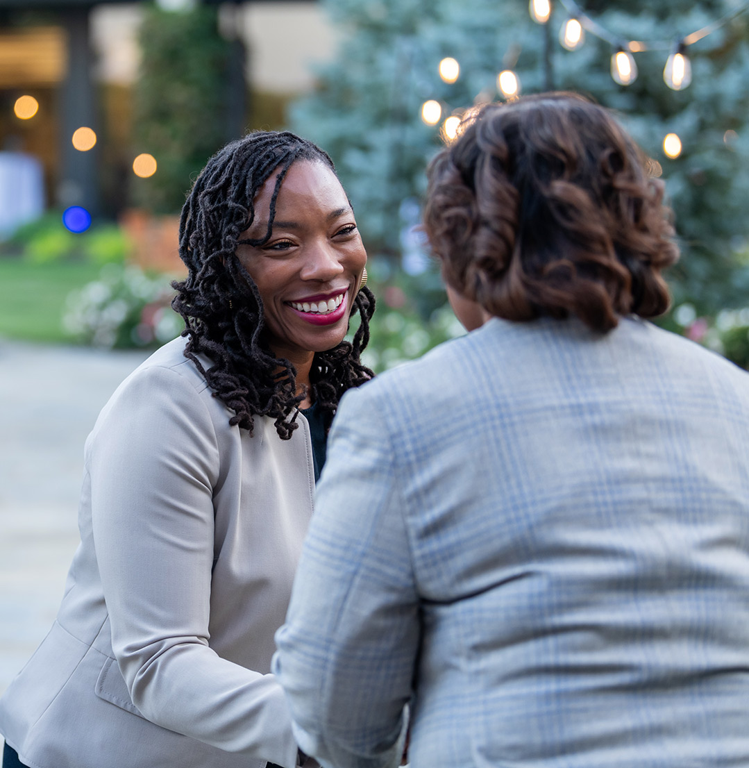 Dr. DeAngela Burns-Wallace greets community members at the end of the blue carpet at the Kauffman Foundation's Open House event Sept. 28, 2023.