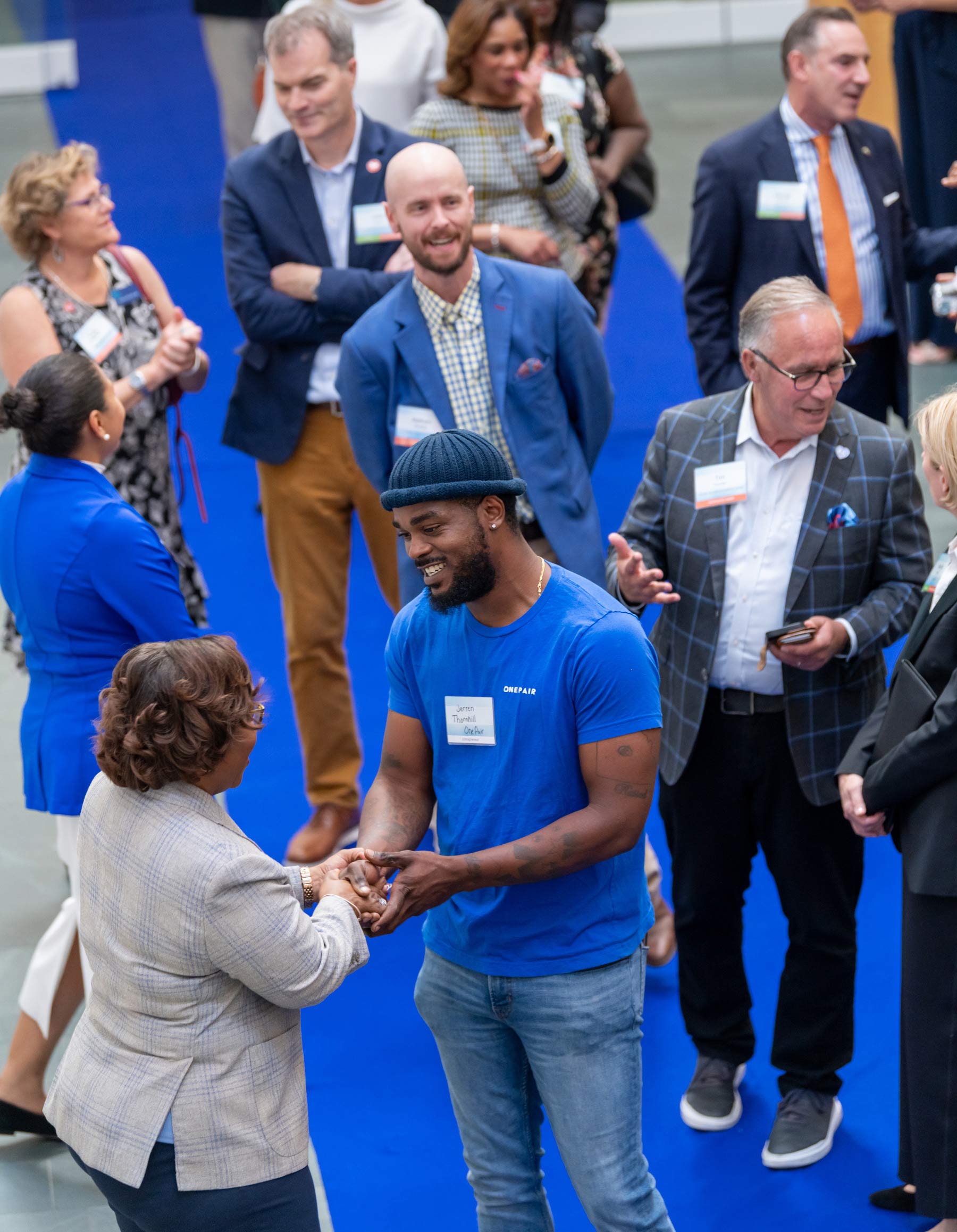 Dr. DeAngela Burns-Wallace greets community members at the end of the blue carpet at the Kauffman Foundation's Open House event Sept. 28, 2023.
