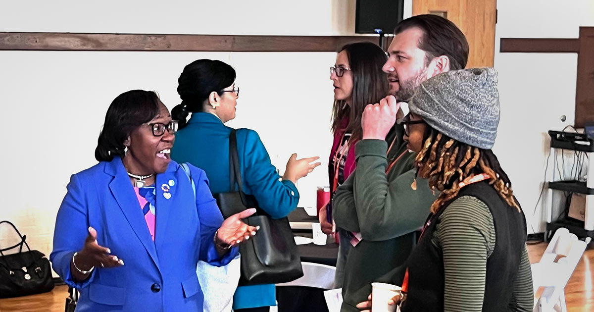DeAngela Burns-Wallace, Ed.D., president and CEO of the Ewing Marion Kauffman Foundation, chats with community members during a GEWKC event in Kansas City, Missouri.