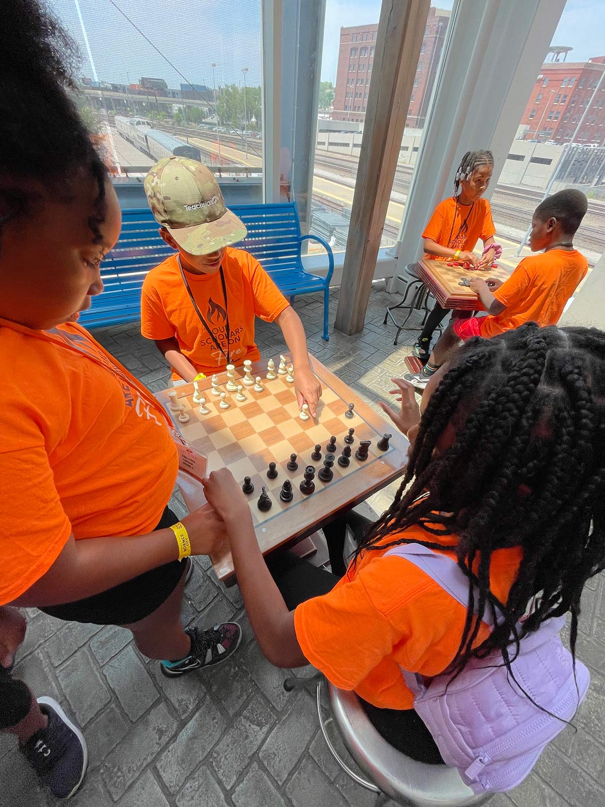 Kansas City young people play a game of chess after school