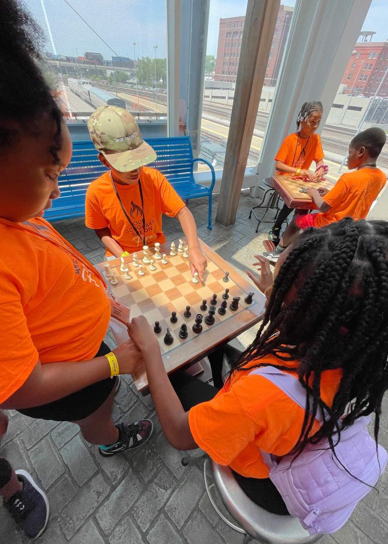 Kansas City young people play a game of chess after school
