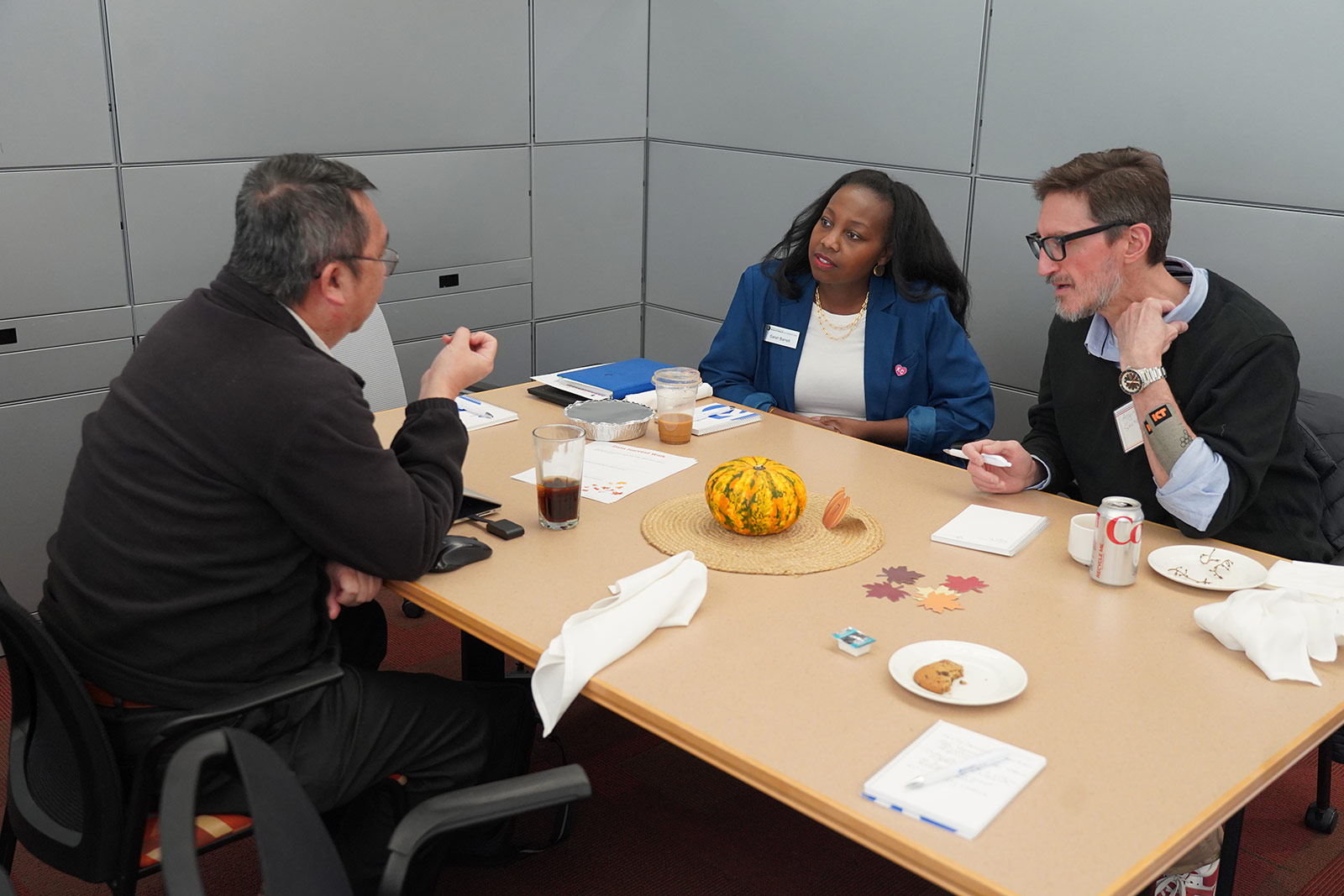 Dr. Sarah Barrett, senior research officer on the Research, Learning, and Evaluation team, in conversation with attendees of the Economic Mobility, Research, and Data Forum.