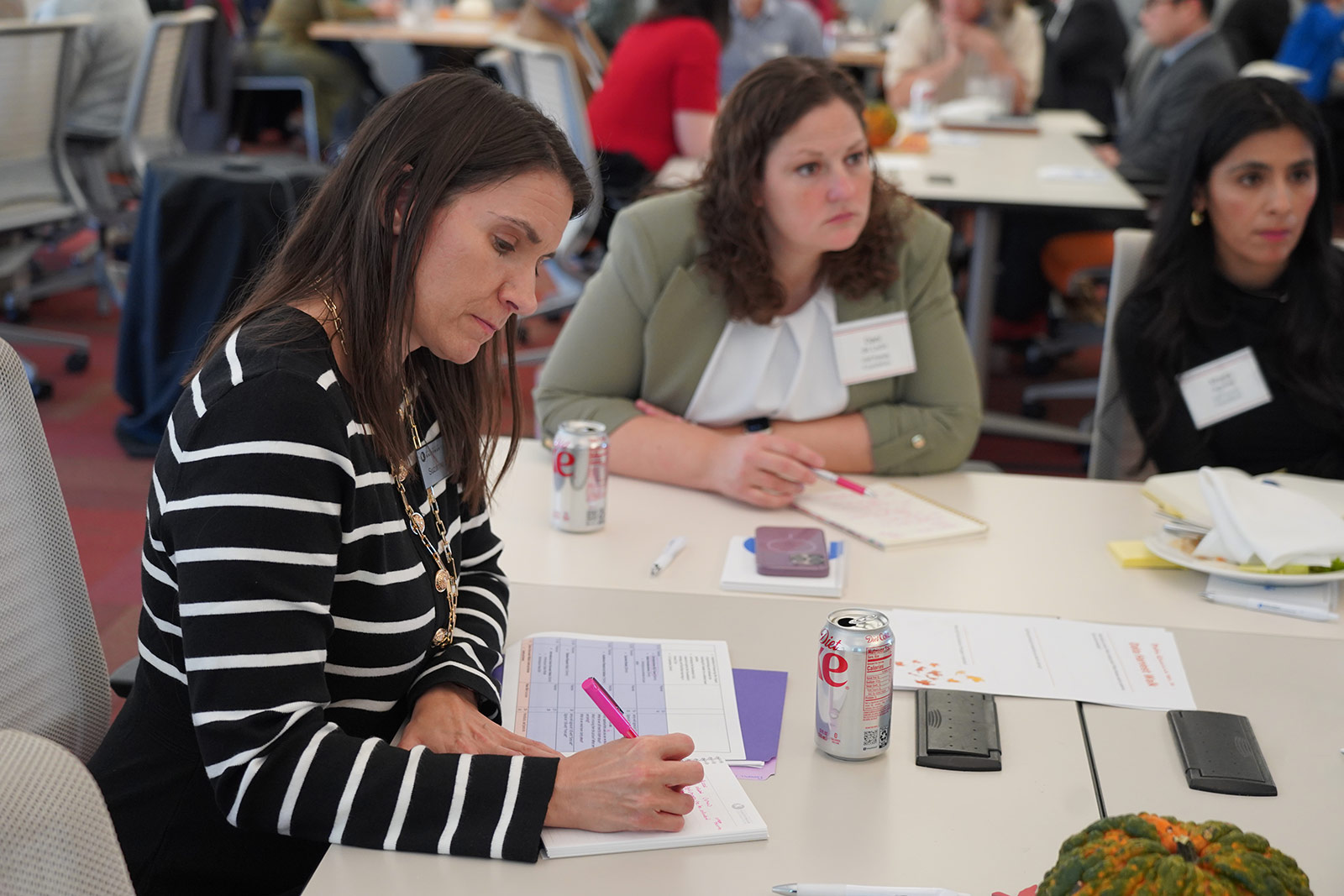 Dr. Suzanne Stluka, director of evaluation on the Kauffman Foundation's Research, Learning, and Evaluation team, takes notes during the Economic Mobility, Research, and Data Forum.