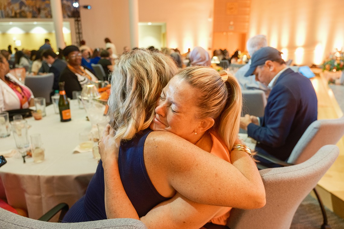 Attendees hug at the 2026 Kauffman FastTrac + 1 Million Cups Summit