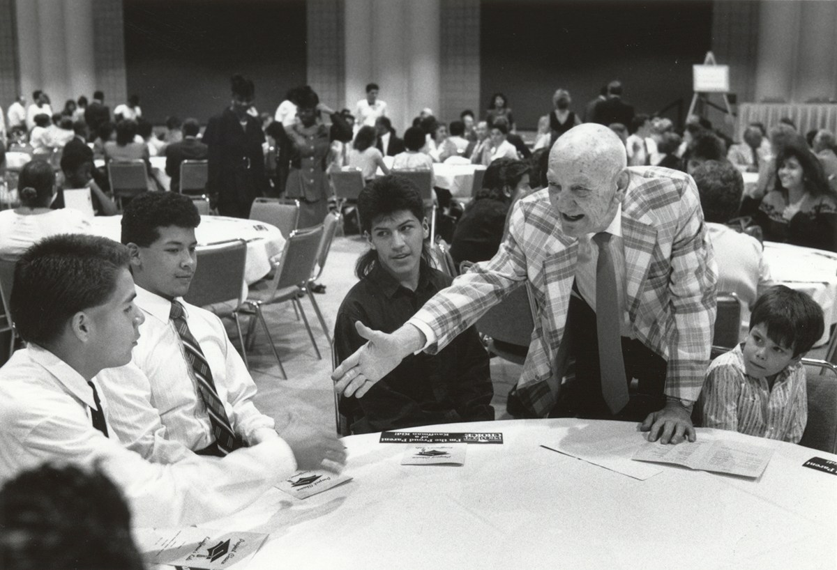 Mr. Kauffman shaking hands with students
